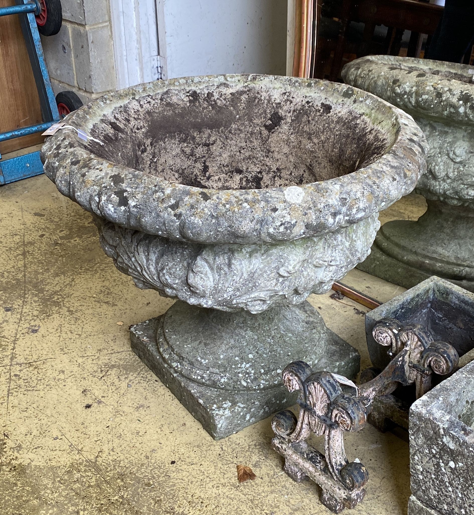 A large circular reconstituted stone campana garden urn on base, diameter 76cm, height 60cm